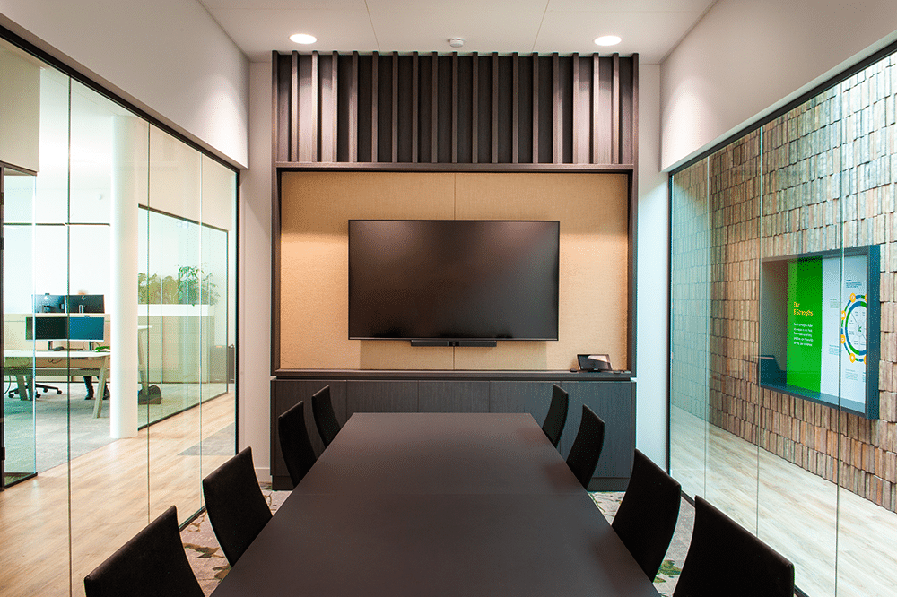 Conference room with Bose Professional VB1, display, and large table.