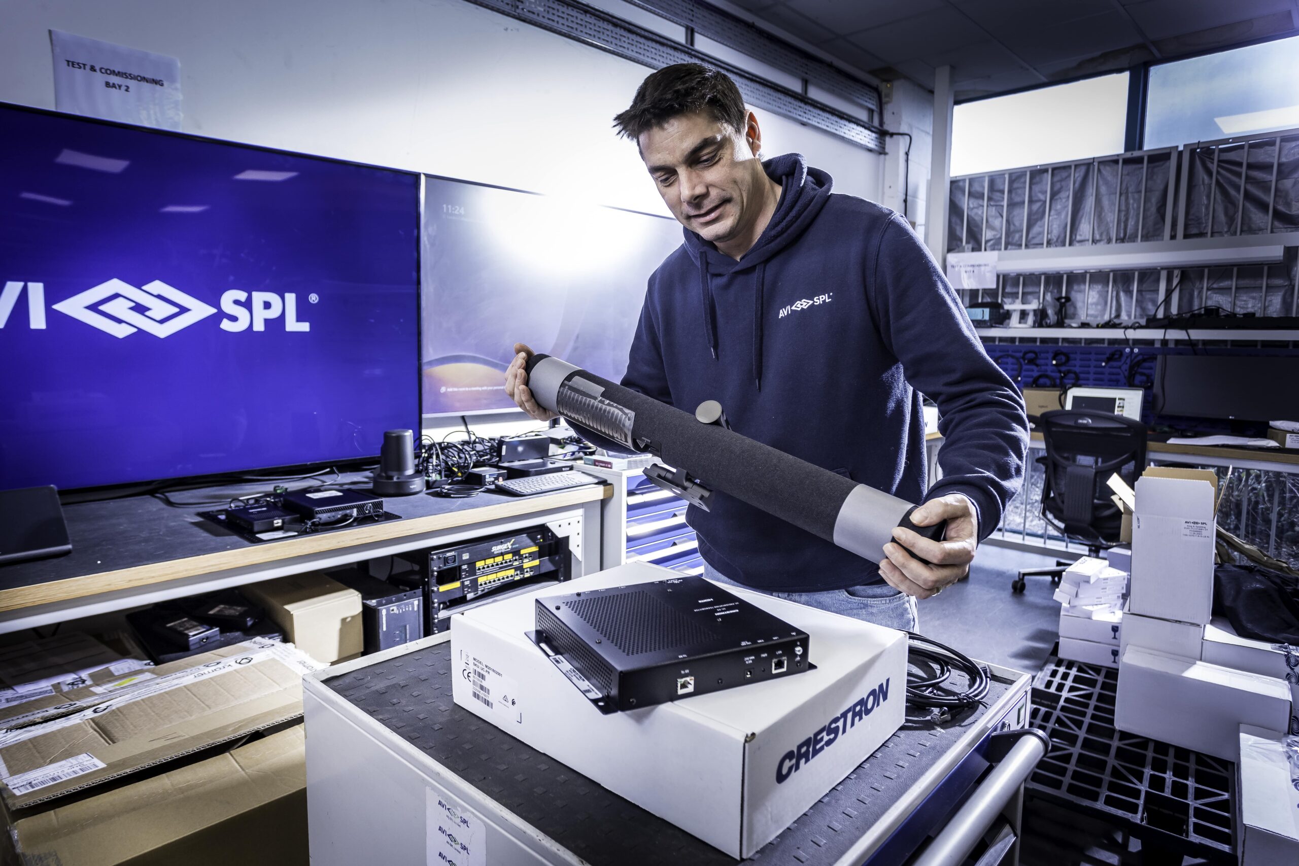 Service technician working on conference room tech